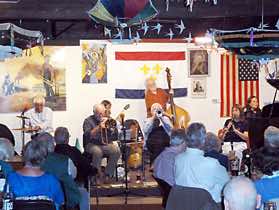 Paul Bacon on drums, Sarah Thatcher on banjo, Jim Blenkin on trombone